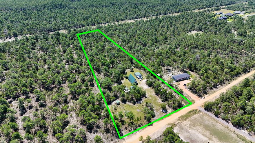 Tucked away on 4.66 acres in the rapid growing Freeport area, this unique A-frame home offers space, privacy, and potential. The home features a distinctive design and a large detached garage/workshop, great for storage, hobbies, or future projects. With room to spread out and make it your own, this property is ideal for those looking for land and opportunity in a great location with No HOA. Buyer to verify all information deemed important.