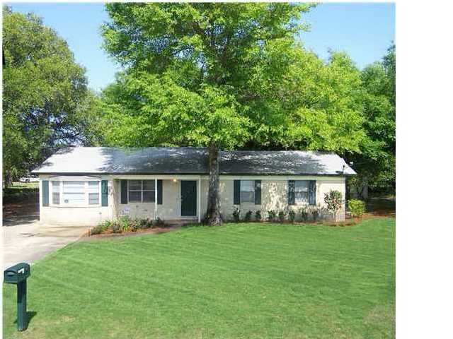 Great location in Elliott Point area, just off Ferry Road, within walking distance to Ferry Park and Elliott Point Elementary. This brick home sits on a large corner lot just across from the bus entrance to the school. The Living Room has beautiful hardwood floors; imported Italian tile in the step down family room. There's also a wood burning fireplace in the Family room which creates a cozy atmosphere for family gatherings. A large picture window overlooks the backyard and a spectacular magnolia tree. Kitchen has been updated with tile flooring and stainless refrigerator. Off the kitchen is a walk thru pantry and laundry room with access to the backyard. Both baths have been upgraded with pedestal sinks and 12x12 tile flooring; both also have tile tub surrounds. This is a