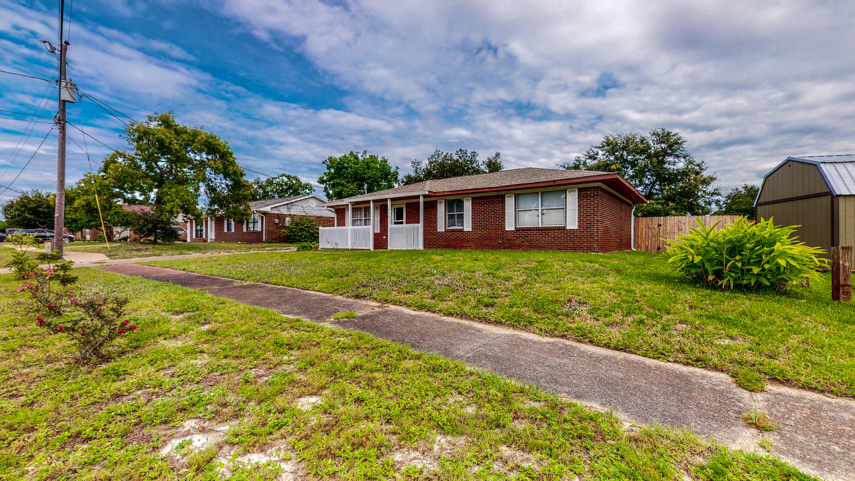 Great Location! This would be a perfect starter home for a young family! ALL BRICK Home with Large Backyard that has a covered porch and is privacy fenced. NO CARPET in this home - ALL TILE! Indoor Laundry Room. Ready for you to move in! Located only 5 minutes from Hurlburt Field.