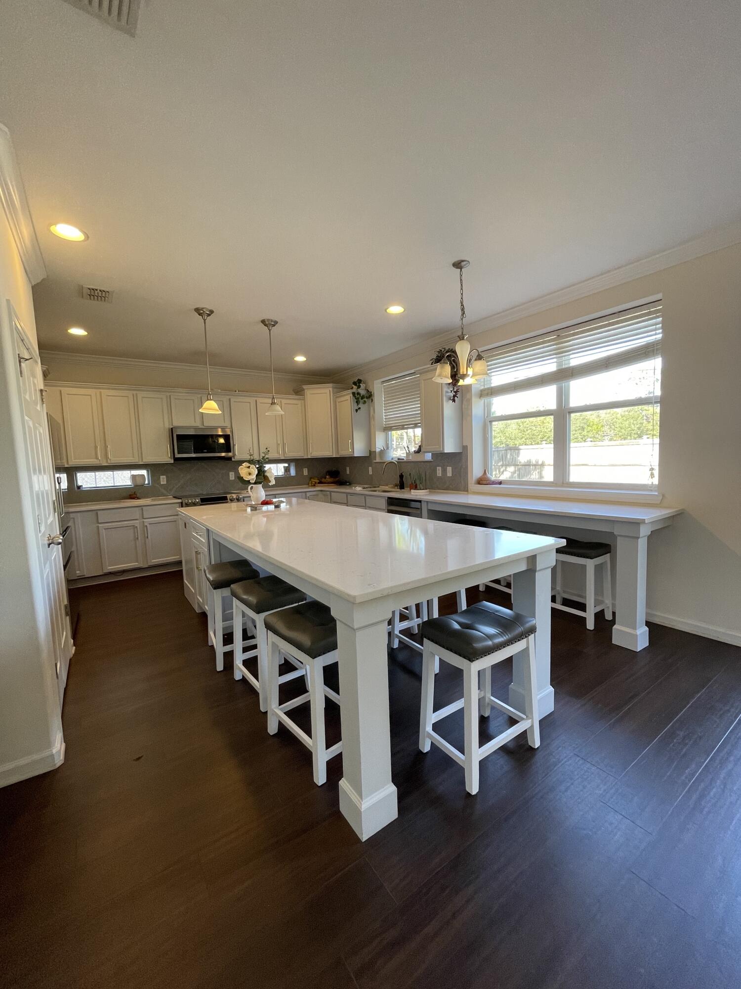 This beautiful 3-bedroom home features a cook's dream kitchen with quartz countertops, upgraded stainless steel appliances, and ample cabinetry. The open layout flows seamlessly into a spacious living area and out to a large, fully fenced backyard-perfect for entertaining guests. Located just outside the gates of Hurlburt Field, this home offers both convenience and comfort. Military Clause/Small Pets with approval and deposit, no smokers, please.