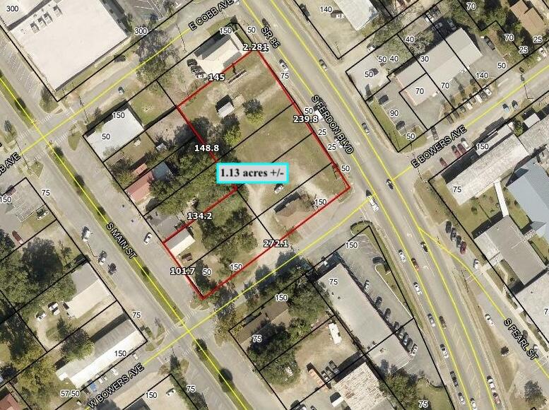 High visibility location on South Hwy 85 with the property fronting both Hwy 85 and Main Street. There are 2 buildings on the property that are currently rented month to month without leases: 592 S Ferdon is 1122 SF, built in 1955 with an effective year built, 1990; 567 Main St is 813 SF, built in 1970 with effective year built 1990. There is also an electronic billboard that is currently under lease.
