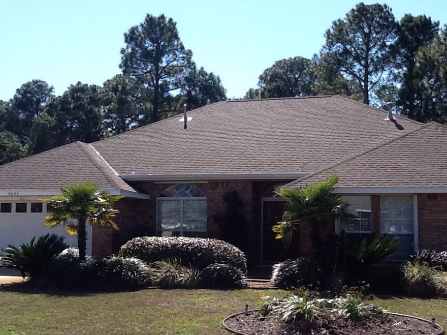 Beautiful 4BR/3BA home with many wonderful upgrades.A Chef's dream kitchen includes a spacious island, granite counter tops, stainless appliances, gas stovetop, stained cabinetry & walk in pantry. Newly painted including ceilings. This home features a gas fireplace, hardwood flooring & large tile, 4 walk in closets, 10X20 Florida Room with thermo pane sliding doors & windows, large decks, hurricane shutters, downspouts drainage system, retractable awning and a back yard tropical oasis with 20 citrus trees and more. Back yard is wooded for ultimate privacy abutting golf course and has a nice outdoor shed over a solid foundation. Wonderful community pool, bath house & picnic area. Property to be sold ''As Is''. Qualified buyers only.