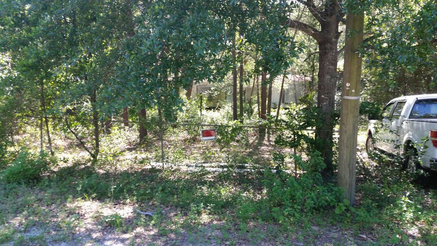 What a wonderful opportunity for someone to make this property their homestead property. This lot is fenced with chain link fence and is ready for a new owner.Currently property has a double wide trailer on the property this not habitable and not accessible. There is a nice 3 stall garage on rear of property which is ideal for just about anything you may want. Great opportunity for you to build a new home on a level lot in central Ft. Walton Beach. A short distance to Middle School and High School. Local Walmart, Lowes and Sam's shopping center within a few minutes drive.