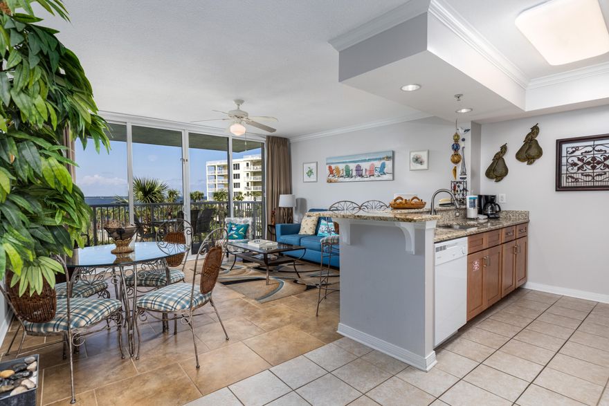 Desirable 4th floor unit at Destin West Bayside Resort overlooking the Choctawhatchee Bay! Rental projection of 50k available upon request. Pelican 406 is sure to impress with its many upgrades including new granite counter tops, granite back-splash, deep double sinks, soft close cabinetry, new sleeper sofa, and all new kitchen appliances. The master bedroom boasts views of the beautiful Emerald Coast while also enjoying alluring views of the Choctawhatchee Bay and lazy river off of the expansive balcony. This unit features beautiful porcelain tile flooring throughout, hallway wainscoting, and stunning Doah Turkish area rugs. Destin West Bayside Resort is an amenity rich property consisting of three pools, two hot tubs, and the signature 700 foot-long lazy river lagoon pool.