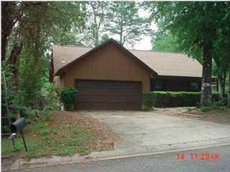 This home has just had a facelift! New kitchen cabinets, counter tops & plank vinyl flooring. Stove/Oven, refrigerator (not warranted) and dishwasher included.  New carpet in living room and bedrooms! This home offers a spacious living room with cathedral ceilings and stately brick fireplace. Large master suite with view to backyard offers plenty of privacy. Fenced in back yard and large deck to add to the extra outdoor living space. There is also a two car garage with plenty of space for additional storage. There is even an indoor laundry room. Sorry no pets allowed. NO Smoking! Any person 18 years old or older must complete separate applications. Tenants required to carry renter's liability insurance while occupying the home.