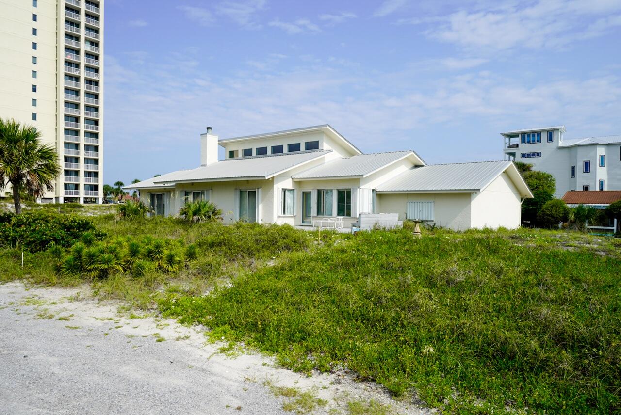 Don't miss this opportunity to live 2nd Tier from the beach in the highly sought after neighborhood of Gulf Pines in Miramar Beach. You will live just steps from the beach and azure blue waters of the Gulf of Mexico. Sit on your terrace and feel the gulf breeze and hear the waves. You will live on .64 acres rising approximately 17.5 feet above sea level on one of the most desirable lots in the neighborhood. Since the home was constructed in 1990, no rising waters from storms have affected the home. If you are dreaming of building the beach home of your heart's desires, here is your opportunity to design capturing views and to construct using the latest building technology and codes. Ready to play now...make this 3-bedroom 2.5 bath home