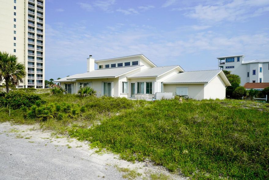 Don't miss this opportunity to live 2nd Tier from the beach in the highly sought after neighborhood of Gulf Pines in Miramar Beach.  You will live just steps from the beach and azure blue waters of the Gulf of Mexico. Sit on your terrace and feel the gulf breeze and hear the waves.  You will live on .64 acres rising approximately 17.5 feet above sea level on one of the most desirable lots in the neighborhood.  Since the home was constructed in 1990, no rising waters from storms have affected the home.   If you are dreaming of building the beach home of your heart's desires, here is your opportunity to design capturing views and to construct using the latest building technology and codes.  Ready to play now...make this 3-bedroom 2.5 bath home