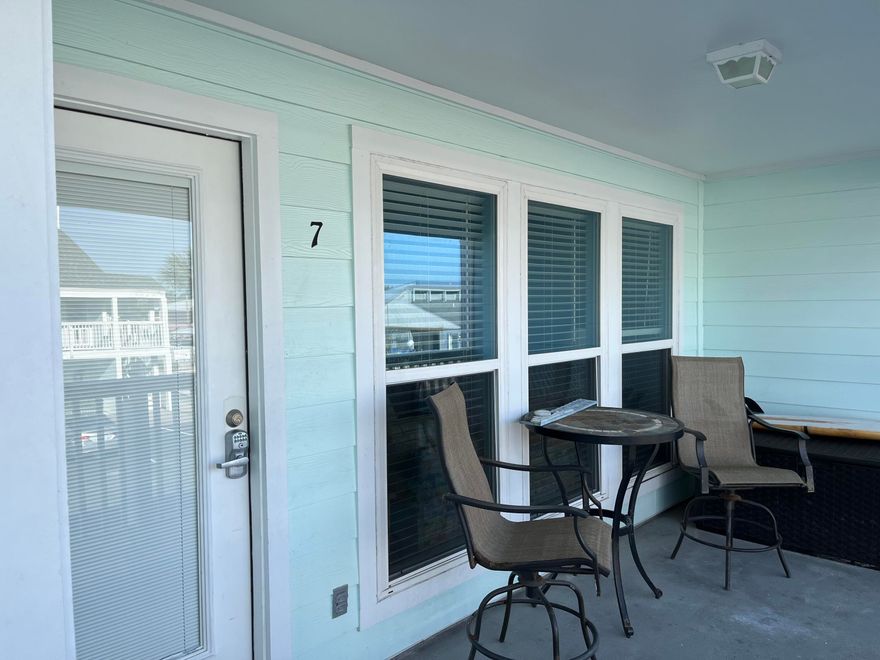 PRICE REDUCTION. Across from the beach with water views.  This 2bd/2bath condo has low HOA fees and excellent short term rental opportunity.  J7 is a well maintained unit with vaulted ceilings and an updated kitchen with granite countertops.This unit is being sold furnished and rental ready.Southwind HOA includes general building  community pool, TV, water, cable, pest control and sewer.