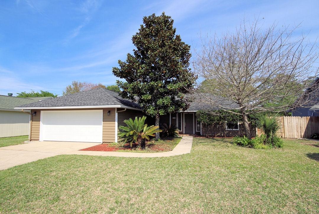 Renovated three bedroom two bath home in the heart of West Destin. The homes on this street do not last! High elevation, no flood insurance required, this home has a beautiful open kitchen with granite countertops, pretty white wood cabinets with glass doors, stainless appliance. Roof within six years old, bathrooms completely renovated; this home is very modern and livable for today's lifestyle. Minutes from Gulf of Mexico, the Harbor Boardwalk, shops, and world class restaurants. Launch your boat at Joe's Bayou for free as a West Destin resident. Walk to Destin Elementary. Only minutes from Destin Bridge, ideal location. Established landscaping, privacy fenced back yard, patio with trellis, home is turnkey. Double pane windows and high density foam in attic for energy efficiency.