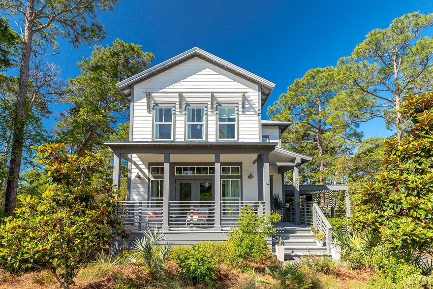 Situated on a rare coastal dune lake this home offers privacy in the heart of Blue Mountain Beach in gated community of Lakeside at Blue Mountain.  The home features 3 porches (one screened) and a large outdoor patio with fireplace and built in grilling area. Only a handful of homes in Lakeside have such large lots and lake access. The outdoor living spaces are a perfect spot to enjoy water views and sunsets over the trees. The home has 4 bedrooms, 3 double vanity bathrooms, 1 powder room and master suites on both floors. The home is fully furnished with high end coastal furniture.  The first floor has a bedroom with large private bathroom and front porch.  Open kitchen and living space with screened in porch that creates a lovely indoor/outdoor flow.  The large round dining area is great