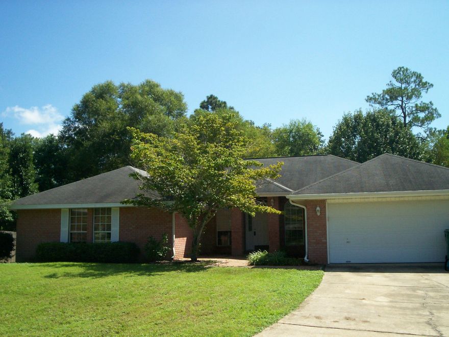 Conveniently located South of I-10, this spacious 2698 sq. ft home is close to bases, shopping and the beaches. With 4 bedrooms and 2 full baths, this home also has a huge great room with a wood burning fireplace. Complete with formal living and dining rooms, this home features a sizeable Kitchen with lots of cabinets and storage space, an eat in area, and a large island and buffet. Perfect for entertaining and family gatherings. Completely fenced and ready for new owners. All dimensions taken from the property appraisers office and should be verified.