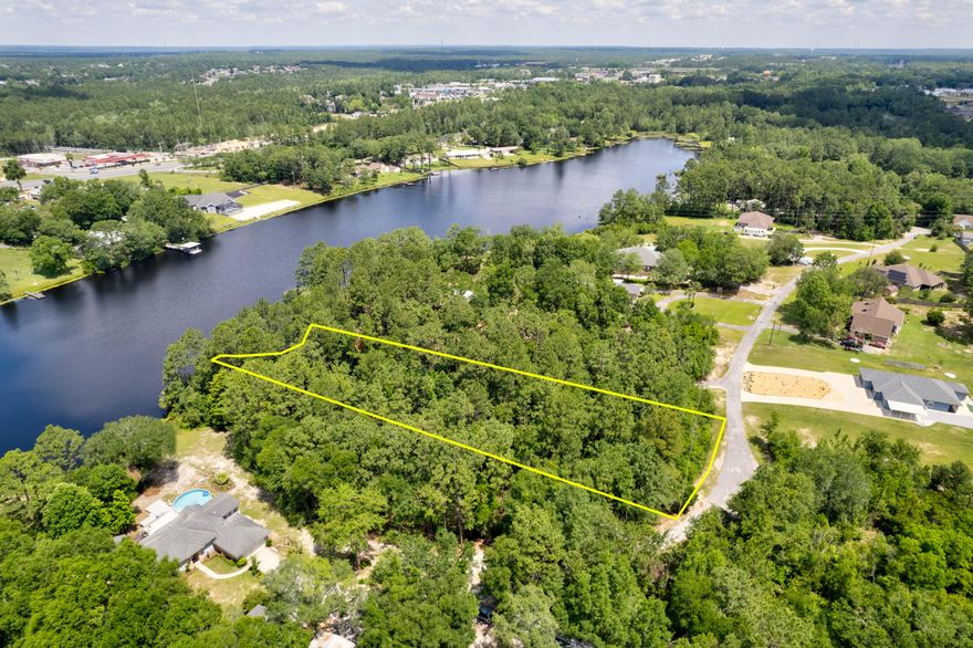 Beautiful 1.07 acre lake front lot south of I-10 with approx 133 ft waterfrontage on a fully stocked 27 acre lake! Check out this fantastic opportunity where you can enjoy fishing and relaxing on your very own little slice of paradise. This property is conveniently located close to shopping, schools, the hospital and military installations. Lake front, undeveloped land without a long commute to town! This property has a very low annual lake & dam maintenance fee (currently $100 per year). Zoned 'single family residence', located in beautiful south Crestview, & just about 26 miles to the white sandy beaches of Okaloosa Island. The best of both worlds, country lakeside living with easy access to the stunning Emerald Coast.Seller financing available with acceptable offer! This property is located in a private community, on a private road.

All information provided believed to be accurate, buyer to verify all facts of importance.