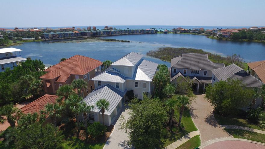 Luxurious living in the Prestigious gated community of Destiny East. This lovely custom LAKEFRONT home boast breathtaking views of the lake and the emerald green waters of the Gulf of Mexico from almost every room in the home. Enjoy the PRIVACY of the POOL/SPA as the sunsets on the lake. This property will make an ideal residence, second home, or investment as a TOP PRODUCING luxury vacation rental. (Projected Gross Rental Income-$137K) 1st Fl. - Mother-In-Law suite, kitchenette - granite counter tops, Addl. Master Suite and living room - ALL OVERLOOKING THE BEAUTIFUL POOL AND LAKE. Take a ride in the state of the art elevator to the 2nd Fl. Gourmet kitchen, stainless steal appliances, Addl. Master Bedroom, living room & dining room ALL over looking the lake with Gulf views.