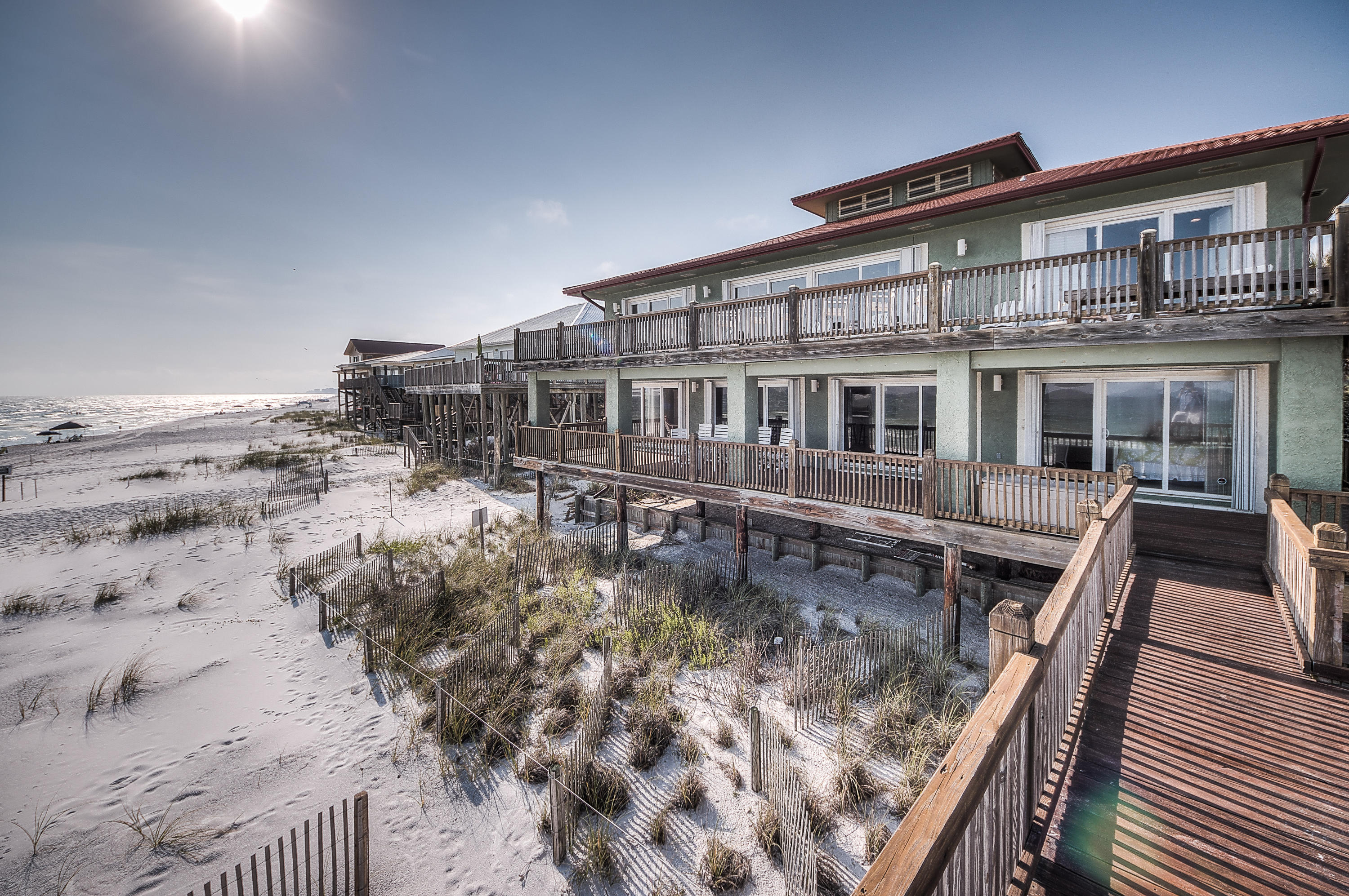 This is a classic beach house that is a MUST SEE!!!! Located just off of Scenic Highway 30A in Dune Allen, this home offers panoramic views of the Gulf of Mexico and Allen Lake. Enjoy stunning beach views and sunsets from the private rear deck. With six bedrooms and five baths, this home is perfect for family gatherings at the beach...with two levels of living space for added privacy! This home can be combined with 53 Fort Panic for a total of 150 feet of private gulf-frontage! Call for more information on this wonderful investment opportunity! Owner Financing Available!!