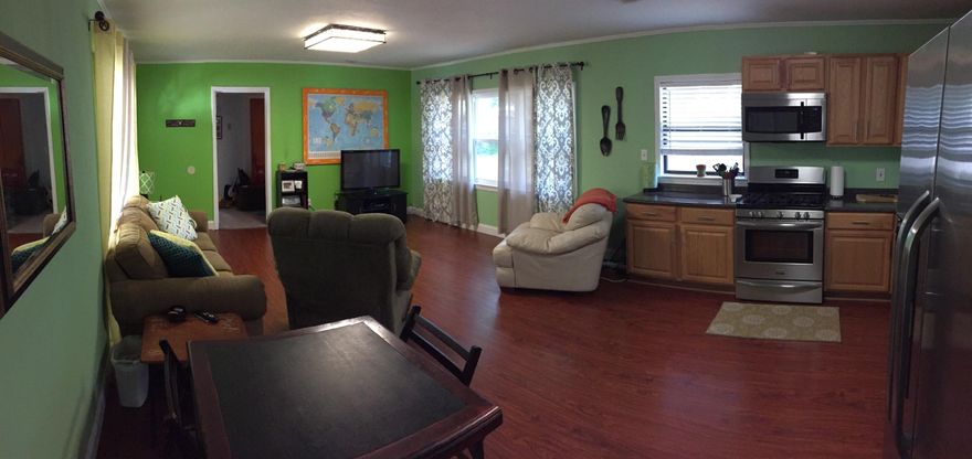 great location. cozy/sturdy block home with tons of upgrades - new impact windows, stainless steel appliances, new cabinets, new flooring, fenced in back yard with shed. enclosed storage/laundry room (washer and dryer used to be outside in car port)