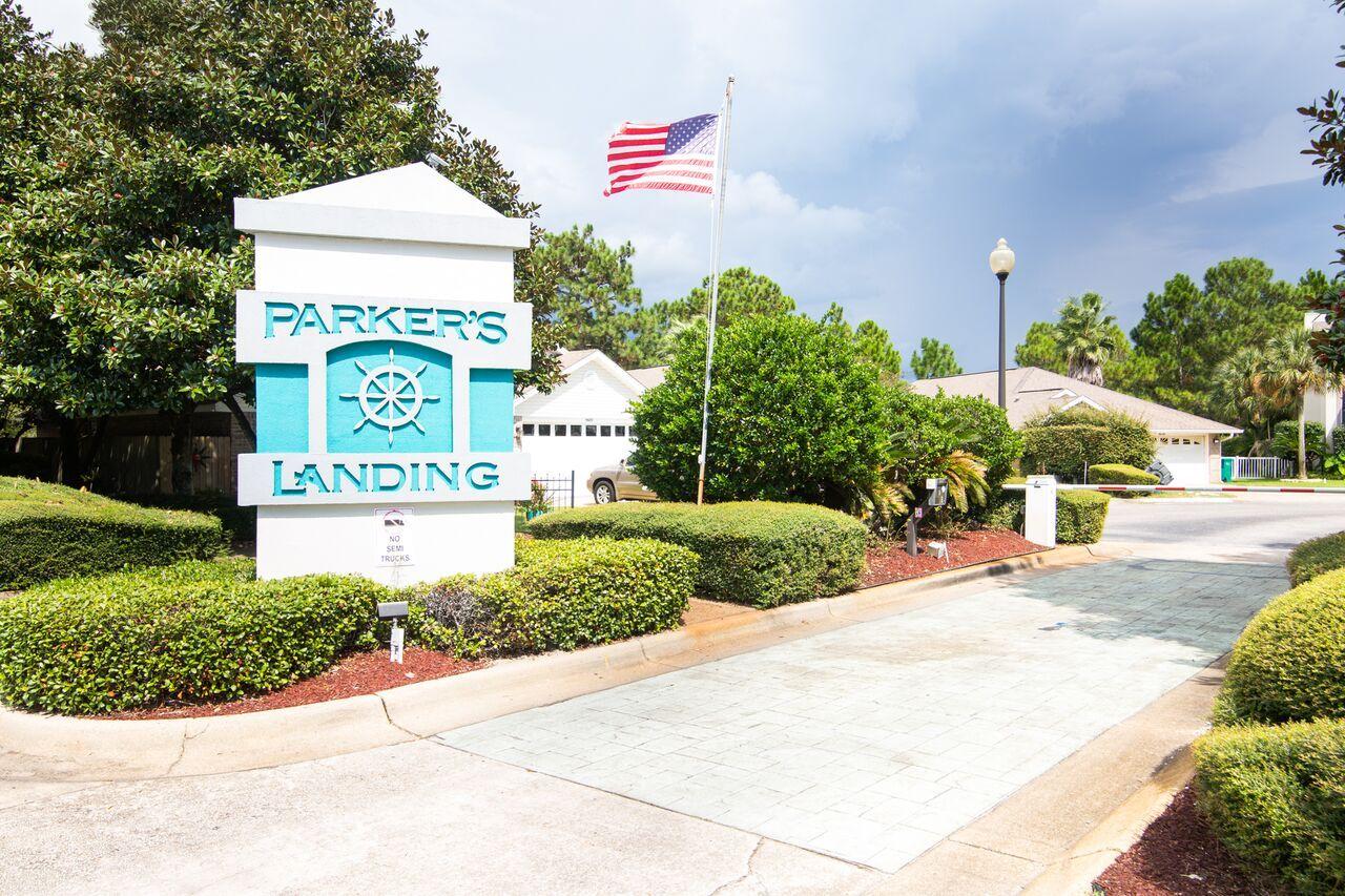 This gorgeous home has new flooring in the living and dining areas as well as the bedrooms. This beautiful home in Parker's Landing, one of Navarre's few gated communities, is priced to sell and in need of a new owner. Just minutes from Hurlburt Field, shopping, beaches, medical facilities, and restaurants, this home has so much to offer. Plus, this gated community has a swimming pool, jogging trail and it's own stocked lake. The home itself features a very well thought-out floor plan, with a spacious living room, formal dining room and an eat-in kitchen. Other features include a large master suite with separate double vanities, a large whirlpool tub, shower stall, cultured marble, and