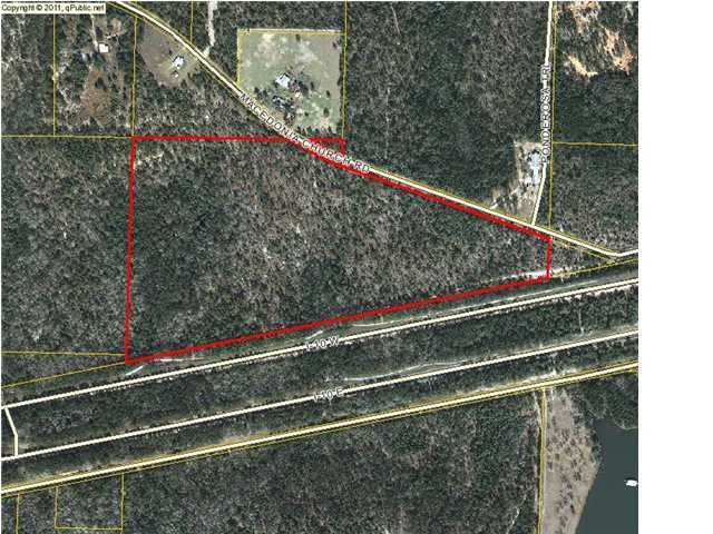 SUPER DEAL. OWNER FINANCING Reduced!! Zoned Rural Village. Attention hunters, outdoor enthusiasts, and nature lovers! Perfect place to get away from it all! 49.4 acres on a paved road in east of DeFuniak Springs.
