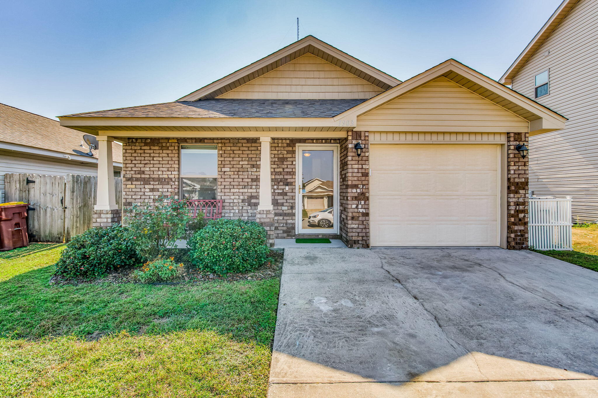 This brick beauty is immaculate and move-in ready! Better than new, with an open floor plan designed for easy living. The home features NO carpet, gorgeous granite countertops, and sleek stainless steel appliances in the kitchen. The one-story layout flows effortlessly, perfect for any lifestyle. Step into the beautifully landscaped backyard, where a charming garden with vibrant butterfly bushes and a built-in sprinkler system ensures lush greenery year-round. Savor your morning coffee as butterflies dance through the air, creating a peaceful retreat perfect for relaxation and reflection Located in a fabulous spot, with easy access to the Bay, Sound, or River. This home truly offers the best of both worlds!