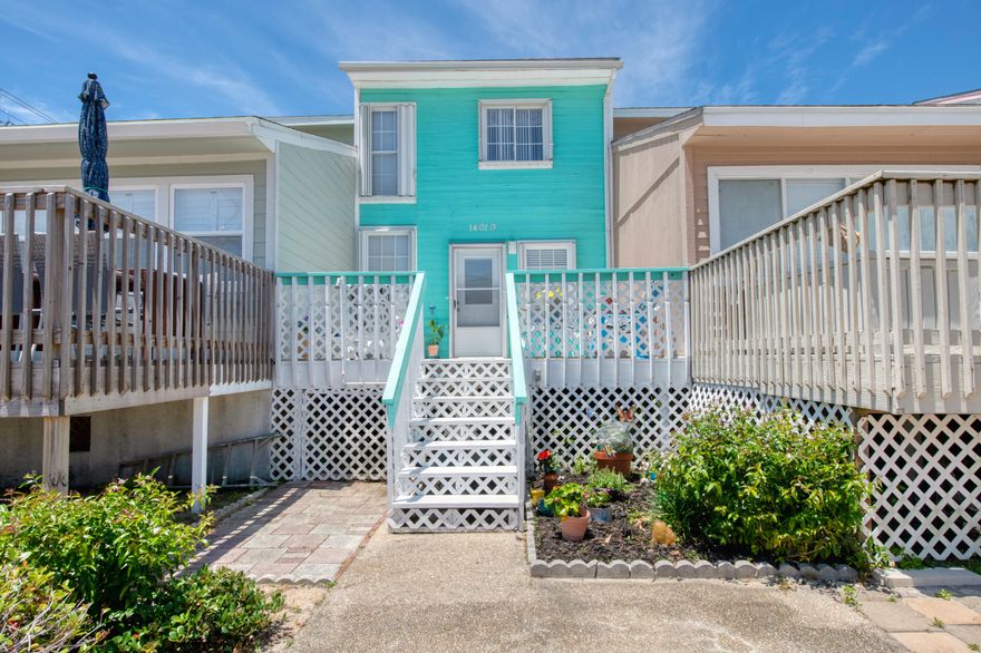 YOUR BEACH PARADISE AWAITS! This absolutely adorable 2 bedroom, 2.5 bathroom townhome located on Navarre Beach features THREE decks for you to sit out and enjoy the Florida sun! Downstairs you will find low maintenance tile flooring, a bright and airy kitchen, tons of natural light and a half bathroom for guests. Upstairs you will find the two bedrooms. The Master bedroom has its on en-suite bathroom with stand-up shower and a balcony. The second full bathroom is upstairs as well. There is laundry in the unit , so no need to run to the laundry mat. The home is hurricane ready with metal shutters for all doors and windows. And if it couldn't get better, its being sold fully furnished! This could be your new home away from home or investment property! Don't wait, schedule your showing today!