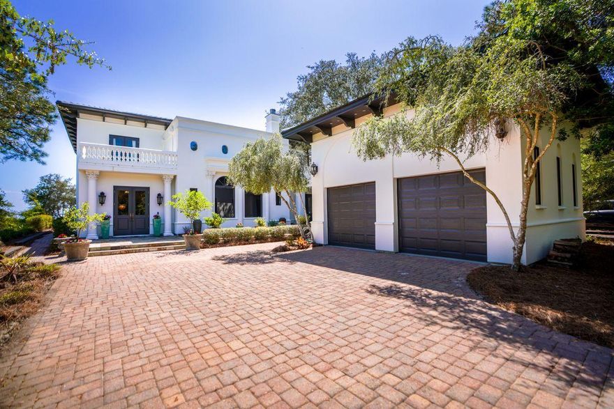 Just imagine the peaceful ambience offered at this secluded private retreat in a gated community, at one with its natural surroundings. It delivers a sheltered and harmonious environment for enjoying the unsurpassed lake and gulf views. The bespoke home has distinctly Italianate features along with a two-car garage separated from the main house by a courtyard breezeway. Wake up each morning to far-reaching views down the whole length of Western Lake from the second floor master with its own sitting area and sun deck. Custom interiors include a lavish fireplace, decorative columns and Terrazzo flooring throughout a plethora of living spaces. The master baths are a temple of pampering with a freestanding ovoid tub and steam shower in one and a soaking corner tub in another. Lake views from M