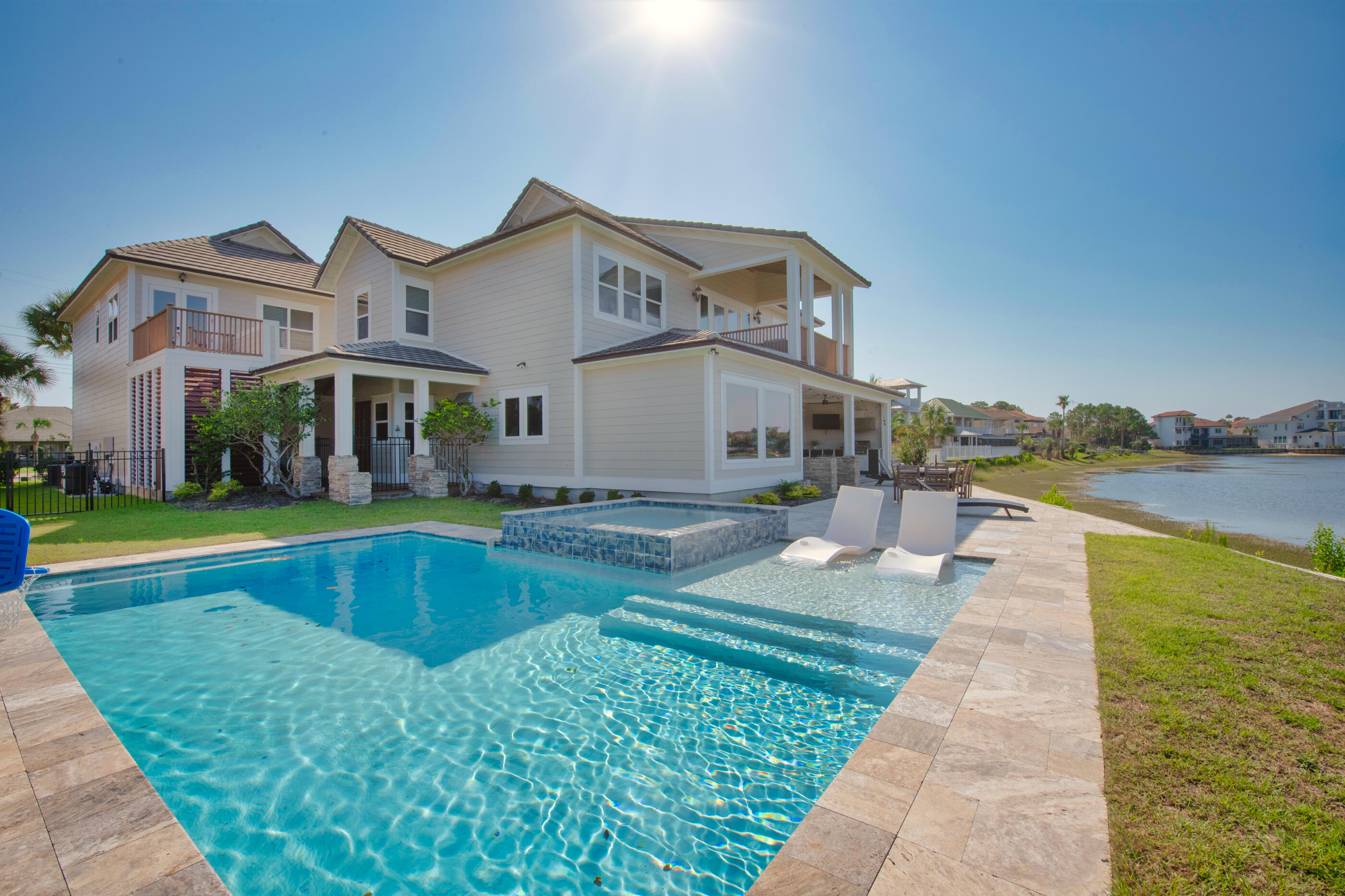 Introducing an exclusive opportunity to experience waterfront luxury in the prestigious community of Destiny East. This breathtaking property, built in 2005 and extensively renovated, is nestled on the tranquil Four Prong Lake, offering a generous 110 feet of serene waterfront and captivating views of both the lake and the enchanting Gulf of Mexico. Spread across 4,579 square feet, this magnificent estate harmoniously blends function and aesthetic, with an open layout that allows for seamless movement between spaces and takes full advantage of the mesmerizing views. The high ceilings and expansive windows create an airy, light-filled atmosphere that highlights the elegant finishes and meticulous attention to detail.The main house boasts 5 well-appointed bedrooms, including a lavish master suite that offers spectacular views of both the lake and the gulf. A stylishly renovated kitchen, large family area, and grand dining space with unobstructed views complete the luxury offering in the main house.
In addition, an opulent guest suite sits above a spacious 3-car garage, featuring a full kitchen, dining room, full bath, and 2 comfortable bedrooms, ideal for accommodating visitors or serving as an additional income source.
Outside, a brand-new pool area and outdoor grill invite you to enjoy alfresco living at its finest. The sweeping vistas of the emerald green waters and pristine white beaches seem to blend with the outdoor space, creating the perfect backdrop for relaxation or entertaining.
This property is located within a friendly biking and golf cart community, offering private access to the gulf and its stunning white sand beaches. It's not just a vacation spot, it's a lifestyle, a private paradise in a coveted area, currently utilized as a short-term vacation rental with gross rental projections exceeding $180k-$198k.
Come and explore the opportunity to own a piece of waterfront heaven where every day feels like a vacation, and every moment reminds you of the beauty of coastal Florida living.