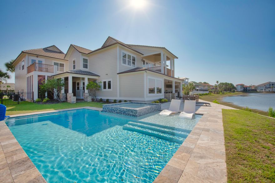 Introducing an exclusive opportunity to experience waterfront luxury in the prestigious community of Destiny East. This breathtaking property, built in 2005 and extensively renovated, is nestled on the tranquil Four Prong Lake, offering a generous 110 feet of serene waterfront and captivating views of both the lake and the enchanting Gulf of Mexico. Spread across 4,579 square feet, this magnificent estate harmoniously blends function and aesthetic, with an open layout that allows for seamless movement between spaces and takes full advantage of the mesmerizing views. The high ceilings and expansive windows create an airy, light-filled atmosphere that highlights the elegant finishes and meticulous attention to detail.The main house boasts 5 well-appointed bedrooms, including a lavish master suite that offers spectacular views of both the lake and the gulf. A stylishly renovated kitchen, large family area, and grand dining space with unobstructed views complete the luxury offering in the main house.

In addition, an opulent guest suite sits above a spacious 3-car garage, featuring a full kitchen, dining room, full bath, and 2 comfortable bedrooms, ideal for accommodating visitors or serving as an additional income source.

Outside, a brand-new pool area and outdoor grill invite you to enjoy alfresco living at its finest. The sweeping vistas of the emerald green waters and pristine white beaches seem to blend with the outdoor space, creating the perfect backdrop for relaxation or entertaining.

This property is located within a friendly biking and golf cart community, offering private access to the gulf and its stunning white sand beaches. It's not just a vacation spot, it's a lifestyle, a private paradise in a coveted area, currently utilized as a short-term vacation rental with gross rental projections exceeding $180k-$198k.

Come and explore the opportunity to own a piece of waterfront heaven where every day feels like a vacation, and every moment reminds you of the beauty of coastal Florida living.