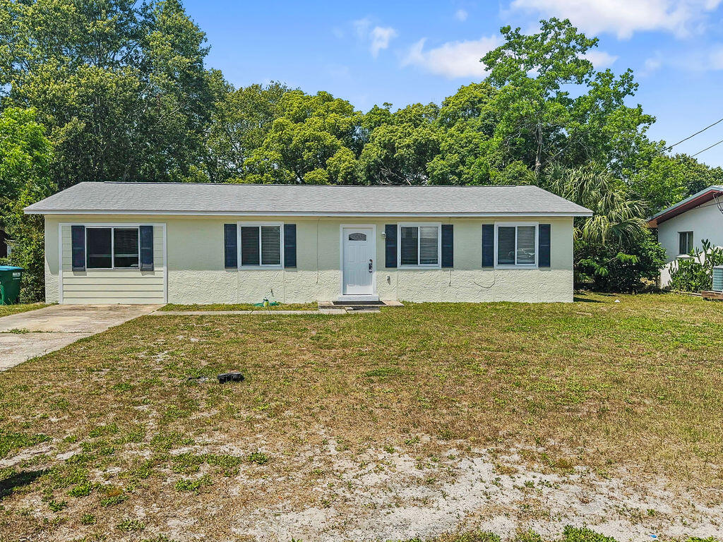 This solid 3-bedroom home, which includes a small bonus room, and 2 full bathrooms, is situated on a spacious 75x120 lot in a wonderful neighborhood. This home offers a newly painted interior, beautiful tile flooring, and a sun-filled Florida room. The main bedroom features a walk-in closet and a Jack and Jill en-suite with a stand-up shower. The oversized lot is perfect for storing a boat, RV, or other recreational vehicles. Located in an established neighborhood with NO HOA fees. The home is just a short drive, bike ride, or golf cart ride away from Frank Brown Park, Gails Trails, Conservation Park and tons of Shopping & Dining options. The subdivision also includes a private park with swings, basketball courts, and a spacious grassy area perfect for pets. Plus, with direct access to Highway 79, you'll have an easy route to the new hospital and can avoid beach traffic during peak season via Charles Griffith Parkway. This property would make a great primary residence or a second home. Short-term rentals are not allowed, and it's conveniently located just over a mile from our beautiful white sandy beaches and emerald waters. Call today to schedule a showing and see all that this exceptional home has to offer!
