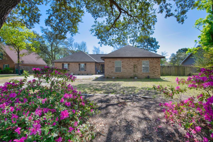 Beautifully updated POOL home in Raintree Estates! Enter this cabin feel property, into a large open floor plan. Featuring shiplap on accent walls, board and batten walls, updated flooring throughout, upgraded kitchen with stainless steel appliances, granite countertops, brick fireplace, a flex room, dining room, a sunroom, well sized primary bedroom with large on suite bathroom, separate garden tub and shower. This home offers upgraded impact windows, newer AC duct work, built in closets, and a beautiful recently added pool! This home also boasts timber cathedral style ceiling in the living room for a cozy feel, two car garage, oversized driveway, and la fenced backyard!