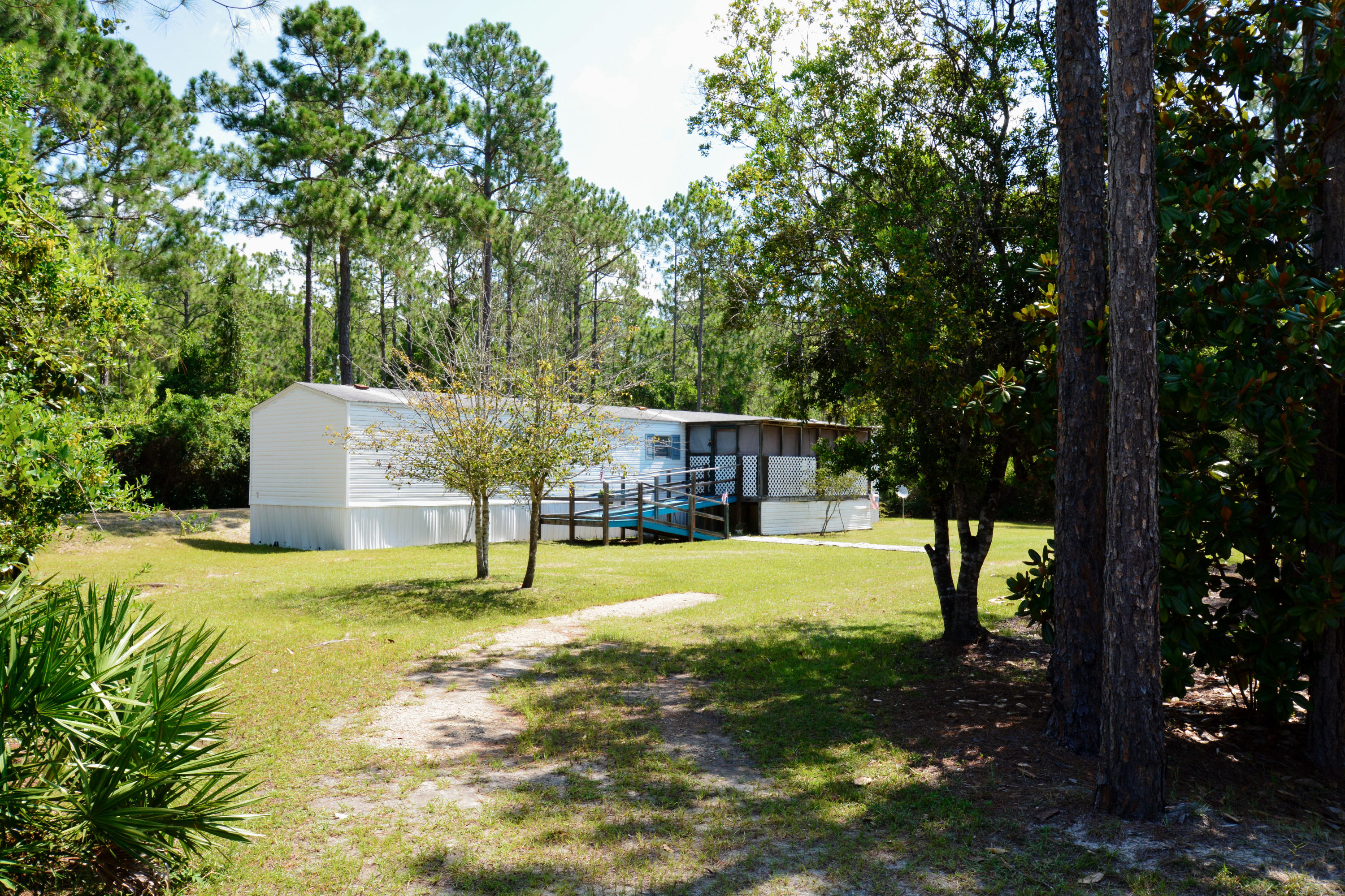 Don't miss out on this great opportunity to own in Santa Rosa Beach. Enjoy peace and quiet privacy, yet conveniently located nearby major roadways, shopping, dining, hospital & medical facilities. And yes, this home is just minutes from the white sandy beaches of South Walton. New owners will enjoy the benefits of a open living space, relaxing screen porch, fully equipped eat-in kitchen, a split bedroom plan, inviting master suite complete with garden tub, double vanities, separate shower and walk-in closet. There is a full laundry room equipped with washer and dryer just off the kitchen area. All this and more sitting on a large level lot. Don't forget to check out the lagre 16 X 20 storage building outback. This home is Priced to sell. Come see for yourself...Call today!