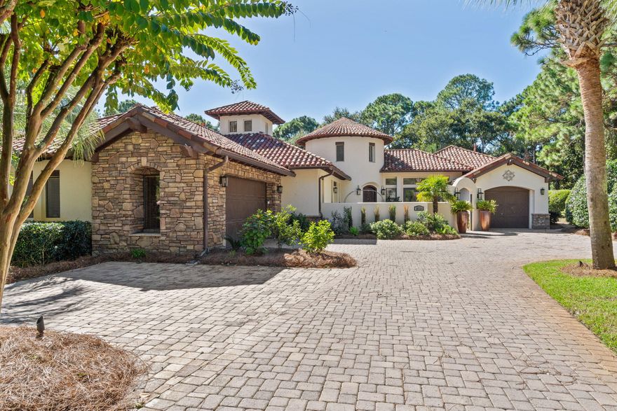 This exquisite custom-built, sprawling, single  story home is truly one of a kind. Tucked away on a prime, estate sized lot and cul-de-sac, located in the gated neighborhood of Burnt Pine and on the 2nd tee box of the Burnt Pine Golf Course, is a Tuscan inspired treasure. At   3,949 sq. ft., 3 beds, 5 baths, plus office, built by Sweet Homes as the builder's residence, the finishes are beautifully extraordinary. The many authentic wooden beams and wood planked ceilings are a timeless feature and from the illuminated brick covered barrel hallway ceiling to the stone accent walls, it is a showplace of craftsmanship and architectural design.  Enter by an arched courtyard gate that leads to a tranquil, cascading fountain.  The grand foyer, with its impressive twenty foot turret wooden ceiling is simply stunning. With a popular open floor plan, the kitchen flows out to many rooms including the spacious dining room, suitable for an elegant dinner party with its a stone gas fireplace, beautiful hardwood flooring, attractive custom built-ins, vaulted wood ceiling and with views and access to a side courtyard. The wine room, with its pretty iron gate, breakfast nook, double door pantry, oversized granite island, perfect for serving and entertaining, are all part of the kitchen. The unique three-sided, stone, gas fireplace that graces the kitchen, breakfast nook, and living room adds lots of charm and seasonal warmth during the cooler evenings. A stone arched way and brick accented walls are also found in the kitchen, along with wooden beamed ceilings and many bronze iron lighting fixtures. Custom, pecan-stained wood cabinetry and millwork are all high-end features found throughout the entire estate the along with 12 foot and taller ceilings. This gourmet kitchen is not only functional, but lovely. It overlooks the large, heated, salt water pool, spa, and wall of fountains. It is the heart of the home with its stainless appliances, including a Bosch dishwasher, a built-in, oversized GE Monogram refrigerator freezer, five burner gas stove with hood vent, warming drawer, double wall ovens and microwave. The home has a built-in sound system in most rooms. Enter the the grand living room and find hardwood flooring and the same pecan-stained wood entertainment center. The ceiling in the living room is showy with more of those eye-catching beams and shiplap styled woodwork and another fabulous, iron lighting fixture. Like the dining room, the living room can easily accommodate the entire family during special occasions, but cozy enough for just two. The walls of sliding glass doors found in the living room stack open presenting a seamless appearance between the indoors and outdoors. They allow access onto the spacious, and recently re-screened outdoor living, dining, lounging, heated pool, spa and wall of fountains. The home wraps around the pool and fountains as it is the focal point. Also found there is the outdoor kitchen which includes a serving island, new Thor double stainless refrigerated beverage drawers, and a new Thor ice maker, a built-in Viking gas grill with a vent hood, more custom cabinetry for added storage, another stone, gas fireplace with wood mantle, TV cabinet, a shiplap ceiling with many beams and six ceiling fans. It's a fabulous place to gather and dine while enjoying our wonderful weather. Or just relax, read a good book and let stress melt away. It accesses a full bath and includes a storage closet. It's important to note that the similar sized lot and adjacent to the home recently sold for $900,000.00. Moving back inside, you will find the master en-suite which overlooks and accesses this great outdoor living area. It really is a special retreat with two full baths, his and hers, a large walk-in/through closet, with many built-in cabinetry, and has a coffee/wet bar with a mini fridge. In keeping with custom features, a trey ceiling, those beautiful hardwood floors and the custom pecan-stained wood cabinets are present. One master bath has a double vanity, a large shower, a free standing spa bathtub, water closet, and a linen closet. The other bath has a shower, single vanity, toilet, and with access to the pool and spa. Designed with a split floor plan, the two guest suites are on the opposite side of the home offering privacy for all. These spacious en-suite guest bedrooms not only have their attached private full baths, they include the hardwood flooring and both have walk-in closets. One guest suite accesses the fountain courtyard for private entry and exit, and the other guest bedroom suite views the side courtyard. The executive office continues with a wall of custom cabinetry for electronics and books, wood flooring, and even has a hidden safe room. The office looks onto and accesses both the front courtyard, for a private entry and exit, and the screened outdoor living area, pool, and the fountains with its trickling water falls that can be heard if the glass doors there are open making it a peaceful working place. The laundry room includes a stainless sink for washing out those sandy bathing suits, and the full sized washer and dryer. There is a security system, central vacuum cleaning system and the home can be entered through the attached two car garage. There is also a separate golf cart garage. No detail has been overlooked here. There is also beautiful landscape lighting on a timer. The exterior has recently been painted with an attractive, off-white shade of Rhino-shield paint, good for many years, two of the three HVAC systems where replaced in 2020 and 2022 with American Standard units, and the two new Navien, tankless, gas hot water heaters were replaced in 2022 along with the GE Monogram microwave oven. 
