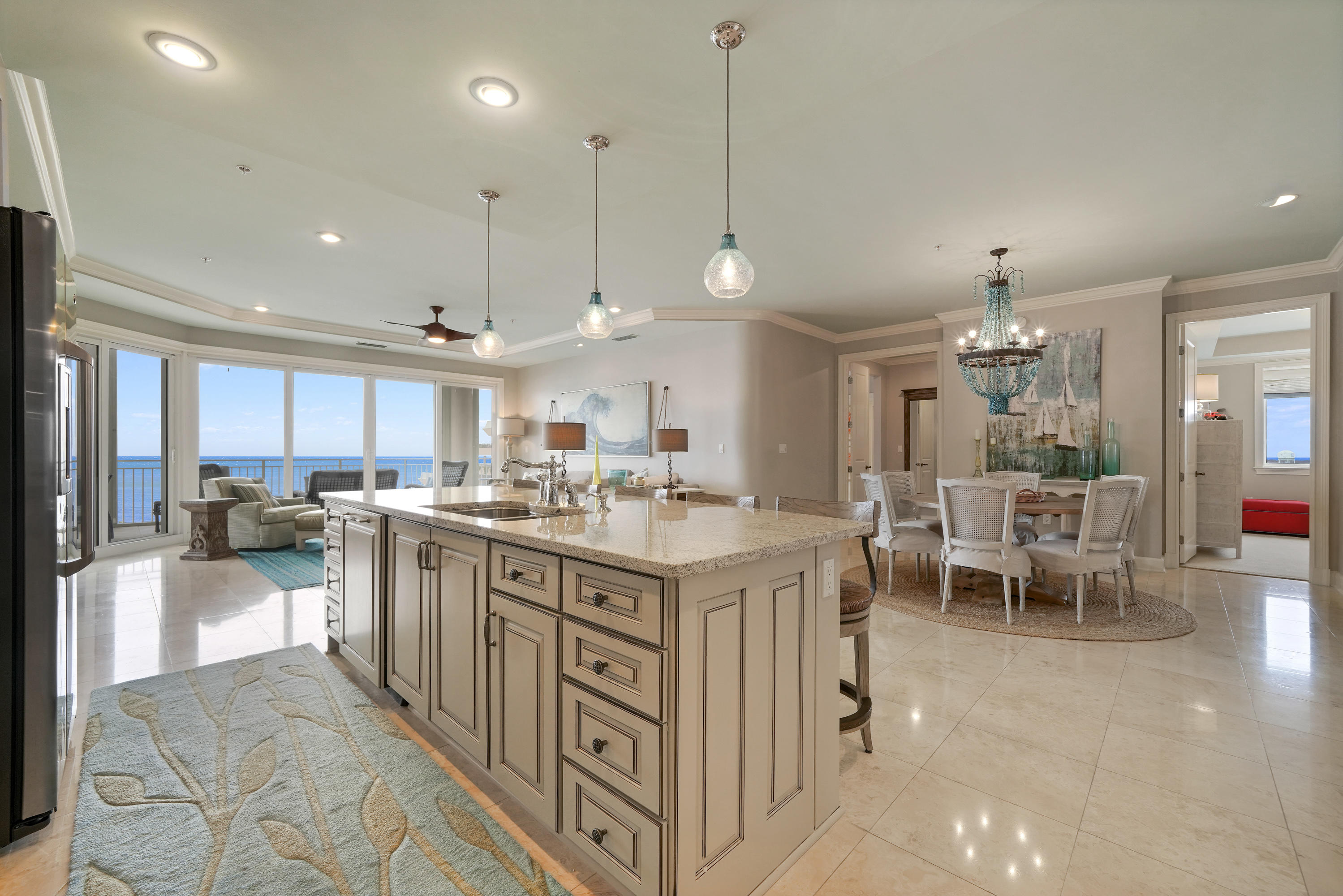 This gorgeous Villa in Grand Dunes II was professionally designed and decorated by one of the top designers in the area and it shows! It is the most sought after floorplan in all of Grand Dunes ( the ''50'' stack ) which is a west-end unit and boast 2,844 sq.ft of living space. This unit has been impeccably kept and all 4 bedrooms have beautiful Gulf views!Features of this unit include: honed, sealed and polished travertine in the foyer, living area, kitchen, hallways and baths, carpet in the bedrooms, new custom quartz countertops in the kitchen and baths, newly refurbished icemaker, new washer / dryer, huge walk in pantry in kitchen complete with built-in custom cabinetry, custom painted cabinets throughout w/ soft-close drawers,