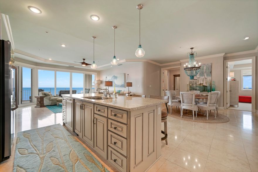 This gorgeous Villa in Grand Dunes II was professionally designed and decorated by one of the top designers in the area and it shows! It is the most sought after floorplan in all of Grand Dunes ( the ''50'' stack ) which is a west-end unit and boast 2,844 sq.ft of living space. This unit has been impeccably kept and all 4 bedrooms have beautiful Gulf views!Features of this unit include: honed, sealed and polished travertine in the foyer, living area, kitchen, hallways and baths, carpet in the bedrooms, new custom quartz countertops in the kitchen and baths, newly refurbished icemaker, new washer / dryer, huge walk in pantry in kitchen complete with built-in custom cabinetry, custom painted cabinets throughout w/ soft-close drawers,