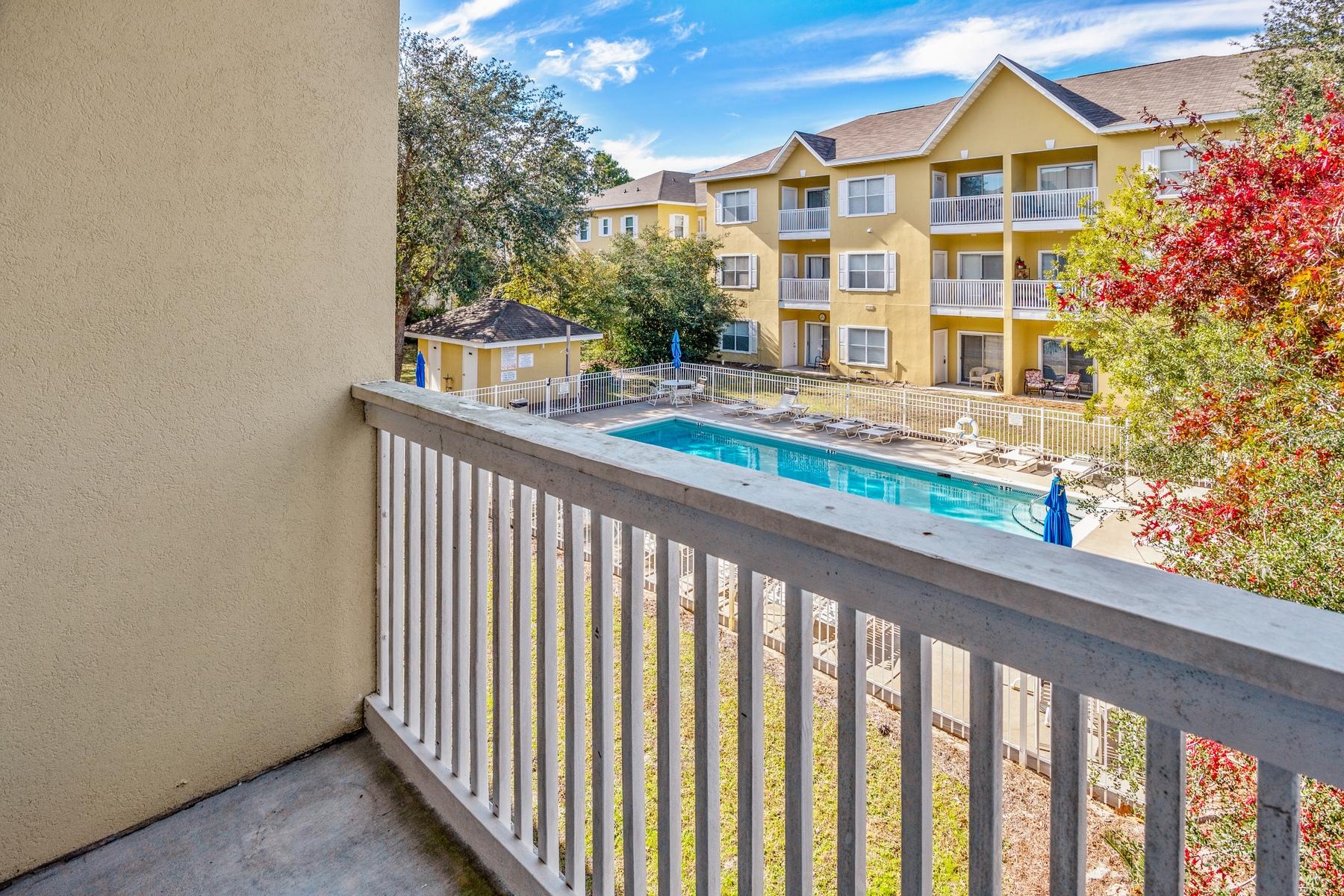 Currently the only unit on the market at Heron's Watch condominiums, this well-positioned second floor unit is well maintained. The two bedroom, two bathroom end unit location has extra windows allowing more natural daylight to brighten the rooms. Neutral flooring throughout the living, dining and bedrooms while the bathrooms and kitchen have tile floors. Black granite countertops and appliances complement the kitchen which has a full range of wood cabinets for storage. Just beyond the living area is a private balcony overlooking the pool with an outside storage closet.