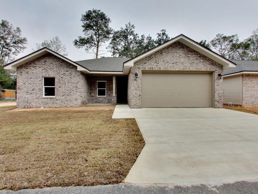 Brand new home, 3 beds, 2 bath in Niceville! Brick and Vinyl exterior, with beautiful modern interior. The kitchen is a masterpiece! Luxurious deep espresso cabinets topped with granite countertops and stainless appliances are enough to make your dream of this room. Add in the recessed lighting and under mount sink with extended eat in area just makes this the gathering place for this home. The master bathroom features dual vanities with a custom tiled shower and a large closet! The two additional bedrooms feature plush carpeting, and large closets. The Great room is a versatile space to accommodate any furniture arrangement. A dining area looking out the double windows is just off the kitchen allowing for a dissection of living and dining areas. Fenced in yard, Washer/ dryer hook ups.