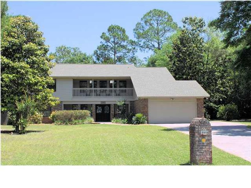 Elegant home situated on a large .41 acre lot in the gated community of Windward of Bluewater Bay. Cross the threshold and you are greeted by a tiled foyer and immediately taken aback by the great room which boasts cathedral ceilings and is flooded with natural light. The dining room is open to the great room and offers ease of access to the fully modernized kitchen boasting solid surface counters, tile floors, an tons of cabinet space. Beyond the Great Room you will find a tiled Florida Room which overlooks the sparkling pool. The large master suite is also located on the first floor and offers a private sitting room overlooking the back yard retreat as well as a large master bath and huge walk in closets. Upstairs you will find two large guest bedrooms complete with ample closet space.