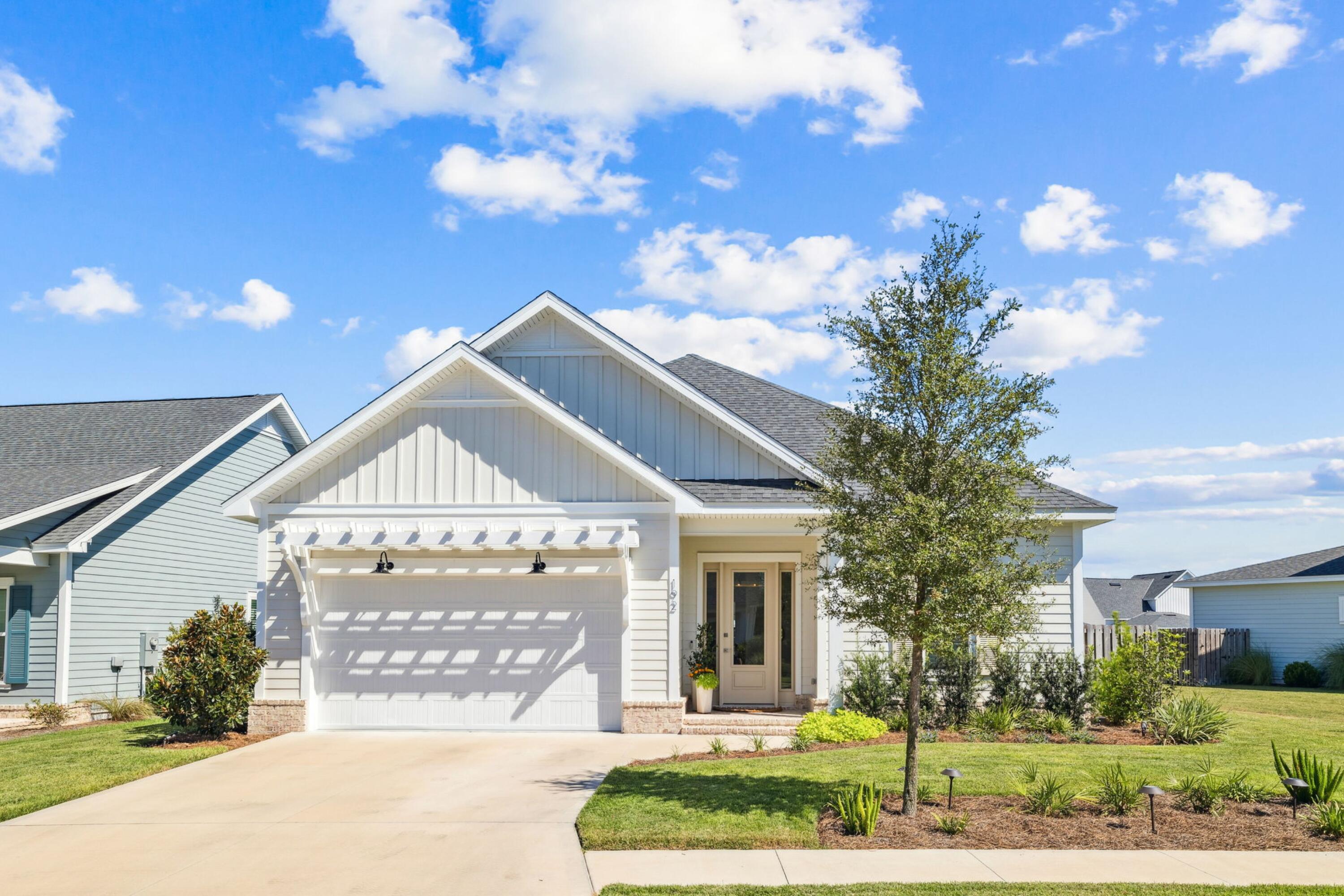 Tucked away on an over-sized, corner lot in Longleaf Park this impeccably maintained and highly sought after single-story Bridgette floor plan is ready to welcome you home to coastal living, just minutes away from 30A! With many thoughtful and functional upgrades, this like-new home boasts the uncompromising quality of Huff Homes with ten-foot ceilings throughout, luxury vinyl plank flooring (no carpet), four inviting bedrooms full of natural light, two pristine bathrooms along with a half-bath. The primary bedroom is perfectly positioned near the rear of the floor plan for ultimate privacy and connects to the en-suite, spa-like primary bathroom which features a double vanity, sleek frameless glass shower and a soaking tub. The heart of this home is in the inviting, open-concept living space, where the kitchen, dining and living room create a natural flow and an intuitive layout for everyday living. The kitchen features an extended quartz island with front-facing cabinets under the bar for additional storage, complemented by high-end appliances including the 30-inch gas range with vented hood, soft-close drawers and cabinetry, under cabinet lighting and modern finishes.
Step outside to your large, screened-in patio with an heirloom brick floor overlooking a serene pond view creating an ideal retreat for both relaxing and entertaining.
Additional highlights include upgraded, melamine wrapped wood closets throughout (no wire shelving), an automated irrigation system for effortless upkeep, a spacious Laundry Room with GE Profile Top-Load Washer and Dryer along with a set of upper cabinets for additional storage. You'll also discover a pair of YOLO Stand-Up Inflatable Paddle Boards and Beach Cruiser Bikes in the spacious two-car garage, which are yours to enjoy with the purchase of this home.
Watersound Origins is one of South Walton's most-coveted coastal communities, known for its outdoor lifestyle, abundant amenities and prime location. Longleaf Park is conveniently located near the front of Watersound Origins making for easy access to Watersound Town Center, the open-air, walkable lifestyle center that continues to bring a new level of excitement and convenience with a growing collection of shops, restaurants and more. Additionally, the Village Commons, the recreational focal point of Watersound Origins, offers exceptional community amenities including a resort-style pool, fitness center, tennis, pickleball, golf, nature trails and access to the Lake Powell dock all surrounded by natural beauty and just minutes away from 30A!