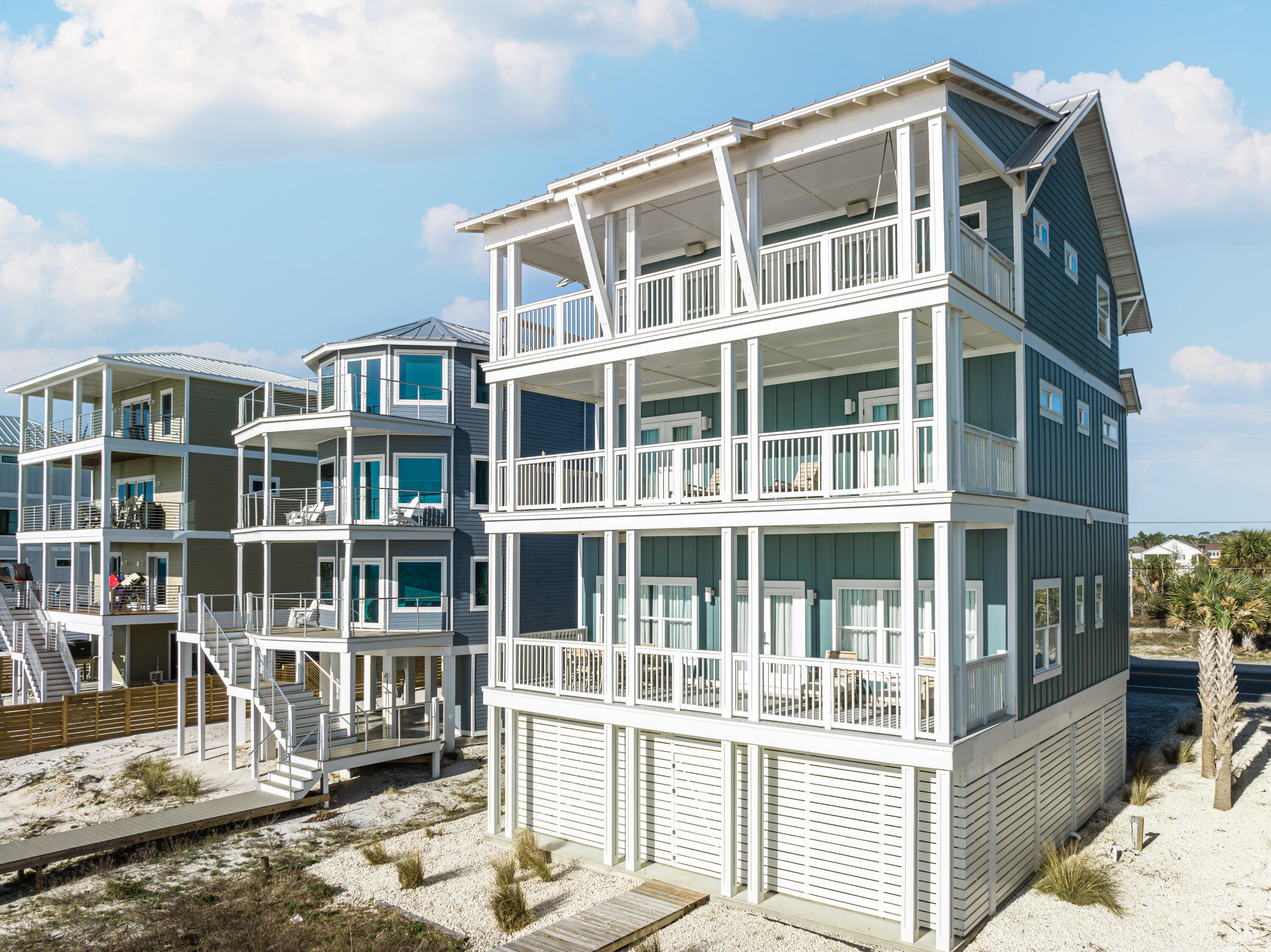 UNDER CONTRACT ~ TAKING BACK UPS! This is undoubtedly one of the nicest houses you'll find from Mexico Beach to St. Joe Beach. Everything in this home is custom and top of the line. The high-end finishes start in the foyer with high-end dirty top pine floors and well-appointed elevator and are found from top to bottom with no expenses spared. You'll find Wolf appliances, marble countertops, designer lighting, Restoration Hardware furnishings and much more. The entire 4th floor is a master bedroom with a sitting area and bath that's to die for with marble floors, soaking tub, huge closet, double tiled shower and more. Each floor has a large deck overlooking the Gulf. All bedrooms have en suite bathrooms and this home is being sold fully furnished