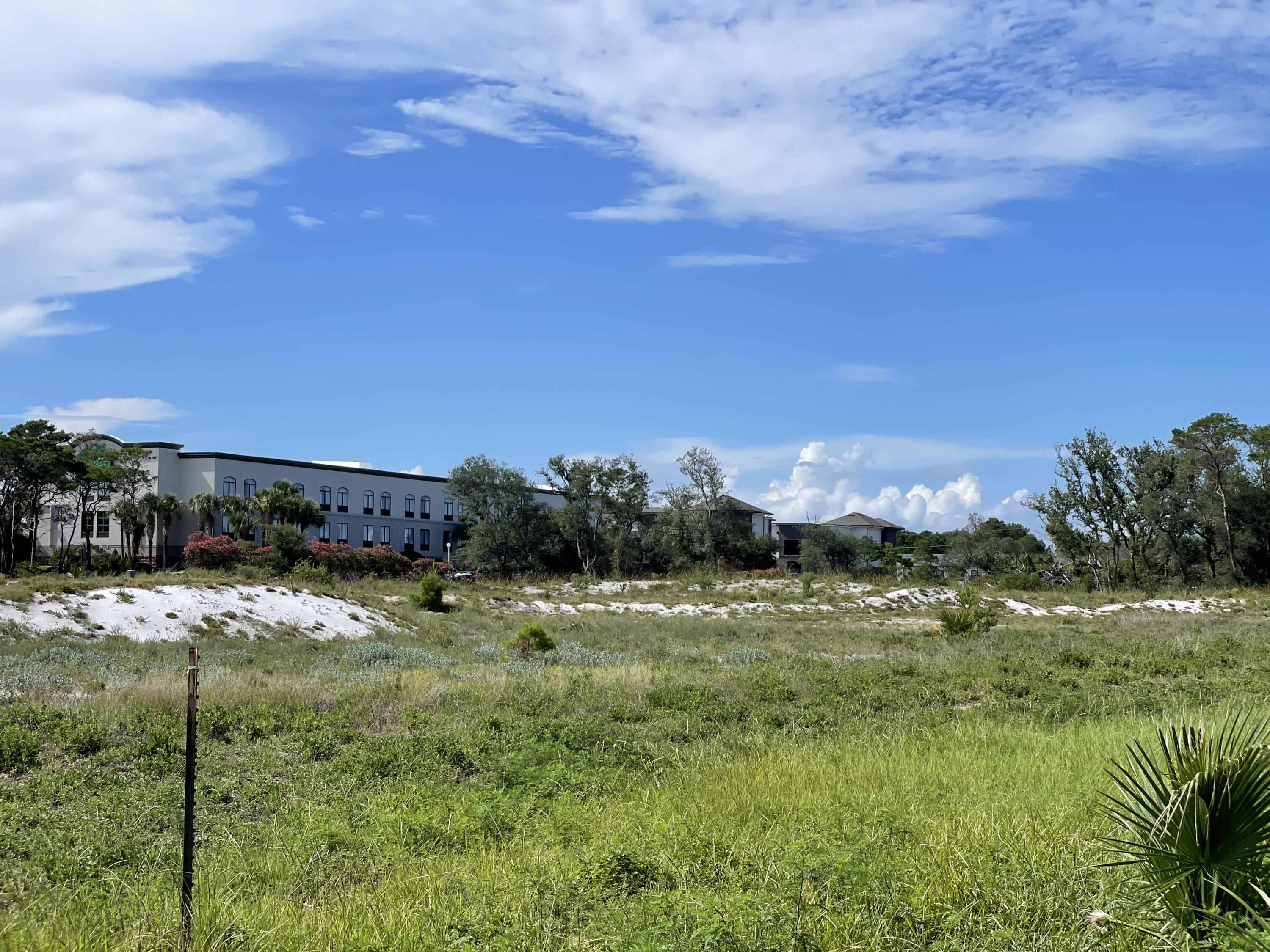 One of the very last, large, undeveloped tracts of land on Hwy 98 in the heart of Destin. This relatively level & cleared 10.25 +/- acreage is located on the North side of Hwy. 98 adjacent to the Big Kahuna Water Park on the East side.  The Gulf of Mexico is to the South, around amusement parks, entertainment, shopping. restaurants, fishing, and gulf front residential. The parcel is zoned Town Center Mixed Use, Commercial. Perfect for one  large or multiple hotels, apartments (with 20% commercial non residential square footage), mixed use, retail, health care development and much more. Seller requires a short due diligence period. Initial EMD $250,000.  Proof of funds or pre approval letter required with contract.Buyer to confirm all information.