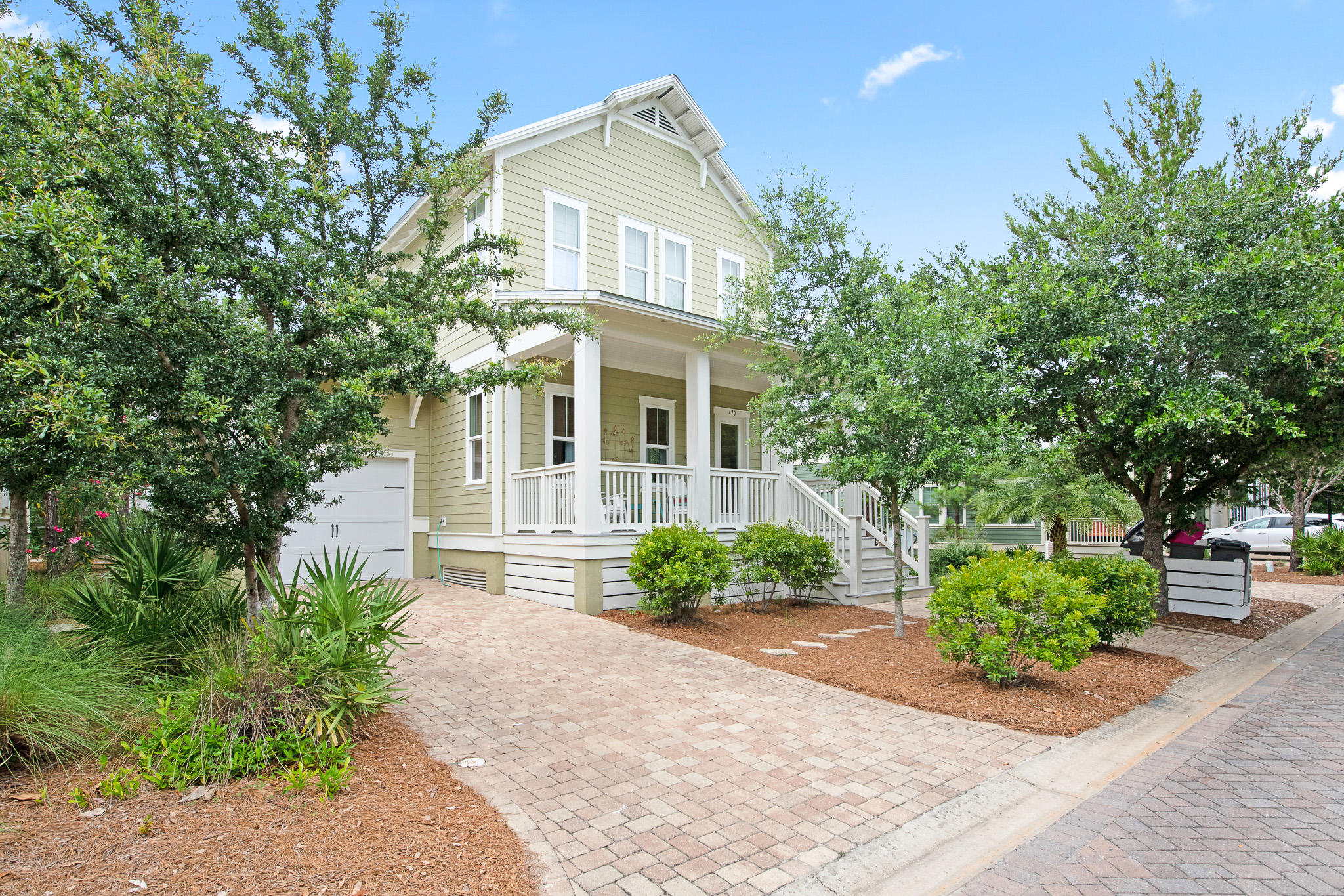 Bright and airy, this 4BR/4.5BA Highland Parks beach cottage is nestled within the popular Highland Parks community in Blue Mountain Beach only minutes from dining, shopping, activities, and of course, the beach! Find high quality construction throughout with 10' ceilings, custom millwork, hardwood floors, granite countertops, a tankless gas hot water heater, brick paver driveway, and more. The open concept living and dining area provides ample room to gather while the fully equipped kitchen features a large center island with seating, GE Stainless Steel appliances, white cabinetry, and a subway tile backsplash. Dual master suites, one upstairs and one downstairs, both include a lovely ensuite master bathroom with a dual vanity and tiled walk-in shower. Two additional guest rooms and a