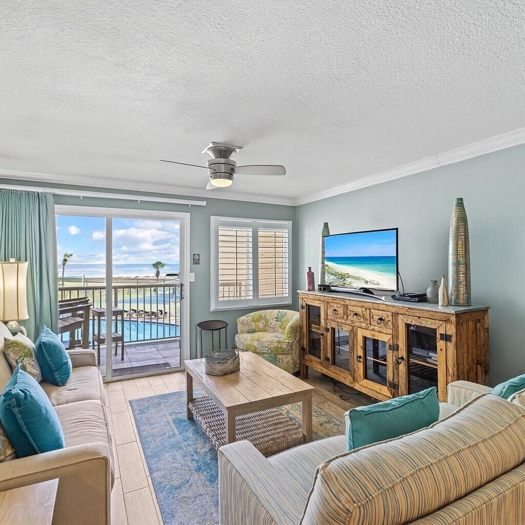 210 Holiday Surf & Racquet Club - 100% remodeled/updated in 2017, this 2-bedroom, 2-bath condo features a blend of style and comfort, with high-end finishes throughout. The renovation included all-new cabinetry, granite countertops, lighting fixtures, plumbing fixtures, and meticulously updated bathrooms. Plank-tile flooring installed throughout the unit, for a clean, modern look. Professionally furnished and tastefully decorated, the condo offers Gulf views from both the main living area and the master bedroom. The kitchen is truly special, with stainless steel appliances, granite counters, a breakfast bar, and custom cabinetry. Additional upgrades include crown moulding, plantation shutters, and designer-color paint selections. The Holiday Surf & Racquet Club provides private beach access, beachside swimming pool, hot tub, a fitness center, and a tennis court with pickleball lines a perfect for enjoying the Coastal Lifestyle! The unit includes a washer and dryer located in the exterior closet.