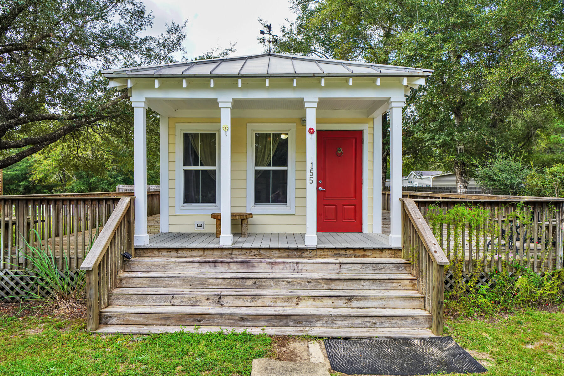Adorable Florida Cottage with an expansive open deck wrapping around 3 sides of the home. Featuring crown mounding, granite countertops, and LVP flooring. Built strong to withstand 165 mph winds, with double-pane windows, metal roof, Hardie board siding, extra insulation for energy efficiency. The home has been part of a rental portfolio generating $1750/monthly. Enjoy a larger yard (approx 1/4 acre), or build on the adjoining lot, all tap fees are paid!