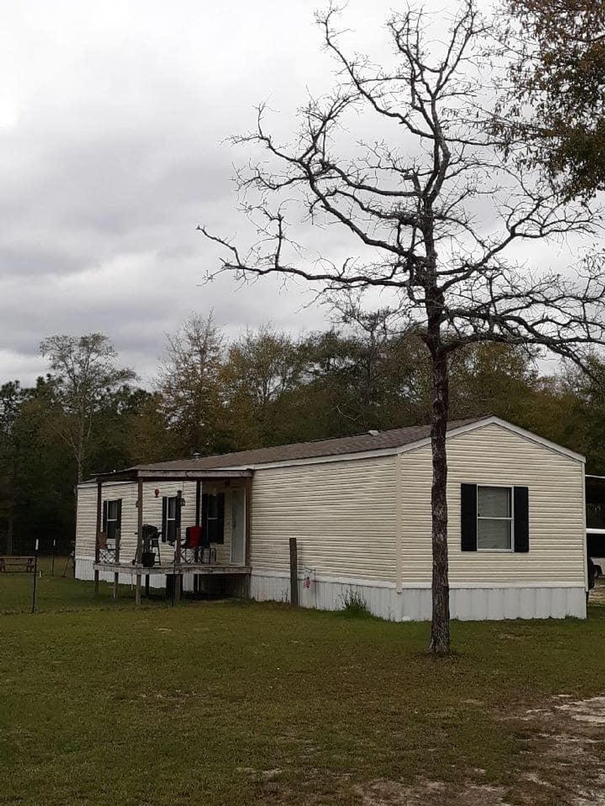 Beautiful cleared property!! 4 acres. Nice Mobile Home! Original Set up from Clayton Homes. 16 x 80 Large workshop 14 x 36 insulated shop!
