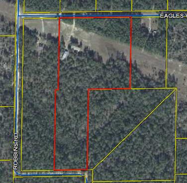 Whether you're looking for a hunting retreat, or a place to call home, this property is the answer!12 acres of land in the quiet north end of Walton County, FL. Deer and other wildlife are plentiful on this property. Sellers had a double wide home on the property and power, water, and septic are already present! Septic was installed about 5 years ago.There is a converted shed on the property that is perfect for spending your hunting weekends, or would be very livable if you have simple needs. The HUGE metal building is 24x50 with and additional 24x25 carport out front. Power is in the building, perfect for storing ATVs/UTVs/farm equipment or working on that project vehicle.Buyer to verify all info deemed important