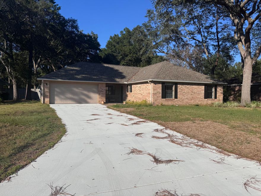 Welcome to this beautifully maintained 4-bedroom, 2-bath home located in the highly sought-after community of Bluewater Bay! This spacious property offers two inviting living areas, a formal dining room, and a modernized kitchen and bathrooms featuring stylish updates throughout. Enjoy the large, fenced backyard perfect for entertaining or relaxing. Recent major updates include a new roof (2020), HVAC system (2020), hot water heater (2022), and a brand-new driveway (2025), giving you peace of mind for years to come. Ideally situated just minutes from the beautiful beaches of Destin, Eglin AFB, Duke Field, and 7th Special Forces Group, as well as nearby shopping, dining, and entertainment. Located in an A+ school district, this home combines convenience, comfort, and quality.