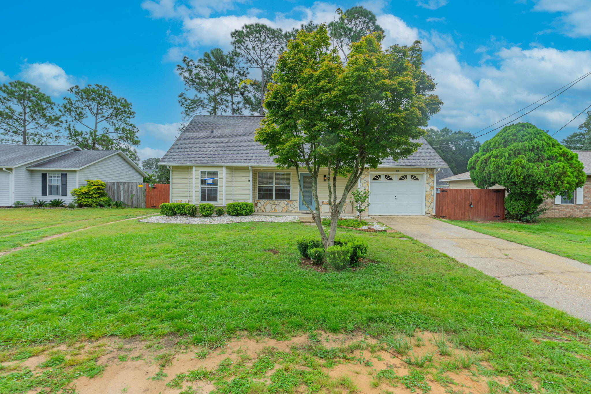 If you're looking for a three-bedroom home south of I-10, look no further-this home will meet your needs! Upon entering the home, you'll be impressed by the size of the family room. The kitchen is galley-style with granite counters and an attractive tile backsplash. The laundry room is conveniently adjacent to the kitchen--on the way to the garage. The two guest rooms are located on the main floor, with a shared full bathroom in the hallway. The primary bedroom is located upstairs, where you will also find the second full bathroom and a large walk-in closet!This home also has the additional feature of a screened porch located off of the kitchen! It's ideal for entertaining! If you're in need of additional storage, you will also find a large shed in the backyard! (Click MORE) This is ready to move in and ready for your insurance inspection! Roof 2025, HVAC 2024, Water heater 2025.