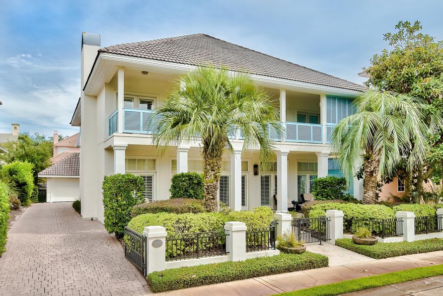 A stylish light-filled 4 bedroom/3.5 bath stunner just a short stroll from the beach graces the tree-lined streets of Caribe. Breezy, deep porches and inviting rocking chairs greet you upon arrival as the gulf sparkles in the distance. Open, bright living spaces stem off the grand foyer beyond the free-form staircase. Gleaming hardwoods, custom closets, a gas fireplace, and many luxurious updates are found throughout this home, offered completely furnished. A gourmet kitchen boasts high-end appliances including a 6 burner range with double ovens, dishwasher drawers, ice machine, and a wine refrigerator. An abundance of workspace will delight  any chef or entertainer.