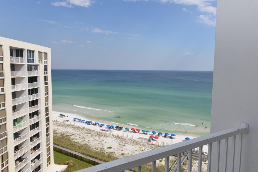 PRICE REDUCED & OWNER ANXIOUS! BRING OFFER! Fabulous gulf views from this 11th floor two bedroom, two bath gulf-front unit. This well decorated unit is located in the desirable Building 2. The living area & all white kitchen are much more spacious than most two bedroom, two bath units. The living room spills out onto a balcony where you can enjoy the gulf breeze & relax watching the waves roll in. Other features include a gulf-front master bedroom, a spacious walk-in closet big enough for extra storage, a stackable washer/dryer, owner's storage room just outside your front door, & upgraded tile throughout the main areas. Shoreline Towers is a gated community located within walking distance of restaurants & shopping. Condo amenities include a pool, tennis courts, fitness center,