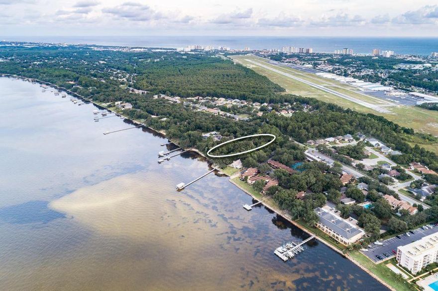 Irreplaceable view on 1.75 acres and includes 2nd lot where an additional home could be built. Beautiful rustic home with an estate sized lot on prestigious Indian Trail. Primely positioned on 195' of pristine water frontage on the Choctawhatchee Bay offering sprawling mature oak trees and a serene naturalistic sanctuary to have a primary family compound or second beach retreat with excellent boating proximity to crab island, Destin's harbor district, and subsequent East Pass. Home includes large outdoor deck for entertaining, boat dock, and covered boat lift. Home has a contemporary charm inside with large glass windows facing the bay and a tongue and groove vaulted beam ceiling in dining area. (1.75 acre includes adjoining lot) Kitchen boasts large island, designer cabinets, granite countertops, gas stove, and sub-zero refrigerator. Additional fireplace in living area. The detached garage is connected with a guest house with its own full bathroom. This property yields over 370' of depth which allows ample privacy. Tons of parking and storage. Bring all your toys.Indian trail is one Destin's most preferential bay front corridors offering close proximity to schools, world class shopping, dining and access to Destin's executive airport as well as the white sand beaches and emerald green waters of the Gulf of Mexico. This unique property is a must see.