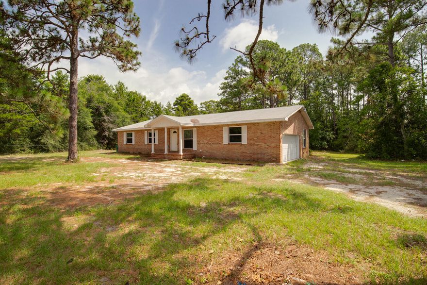 ATTENTION LAND LOVERS, INVESTORS & BUILDERS...IF YOU WANT ALOT OF YARD, THIS IS THE HOUSE FOR YOU. ALMOST 1 ACRE IN MARY ESTHER THAT BACKS UP TO EGLIN RESERVATION. TOTAL PRIVACY!!! NICE RANCH STYLE, BRICK HOME, WITH HUGE KITCHEN & BEDROOMS & A SEPERATE 540 SQ FT. HEATED & COOLED REC ROOM OR MOTHER INLAW SUITE WITH PLUMBING AND WATER NOT INCLUDED IN SQUARE FOOTAGE IN THE BACK OF MAIN HOUSE. COPPER WIRING & DOUBLE PANED WINDOWS & HARWOOD FLOORING THROUGHOUT. AND LOT HAS PLENTY OF ROOM FOR EXPANSION. COME SEE FOR YOURSELF