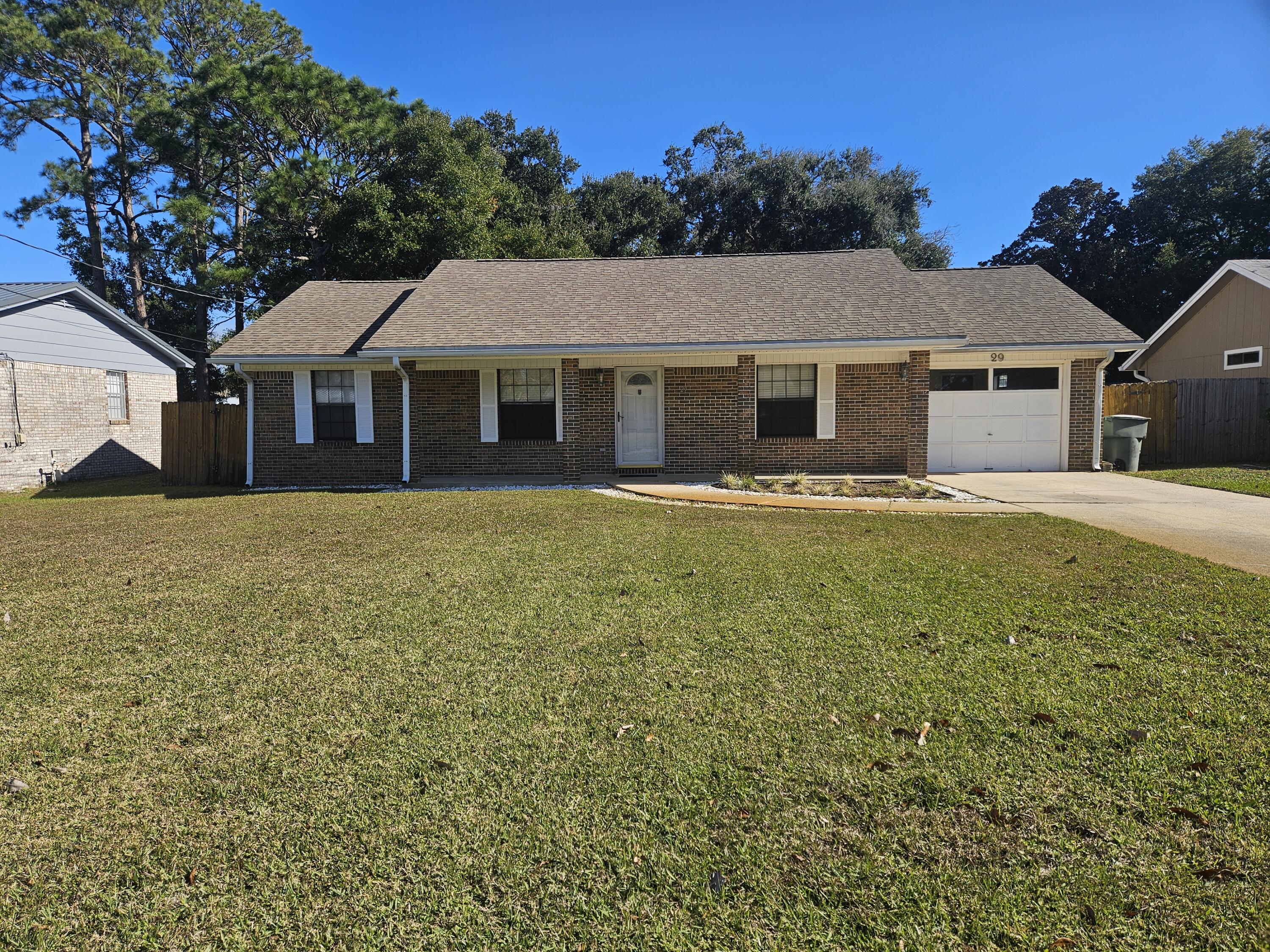 Conveniently located in the Heart of Ft. Walton Beach.  Split floor plan with Cathedral ceilings, crown molding, dining area with French doors leading to an oversized wooden porch.  Large sized kitchen with plenty of cabinet space including a breakfast bar, stainless steel stove, built-in microwave and dishwasher.  Off of the kitchen you will find the laundry room with extra storage space.  The backyard is completely enclosed to provide maximum privacy. In addition, A/C was replaced in 2021, garbage disposal replaced 3 months ago, Water Heater replaced in 2022, and sprinkler system upgraded at the beginning of summer season 2024.  All appliances (Stove, Microwave, Dishwasher and Refrigerator) to remain in house AS-IS.